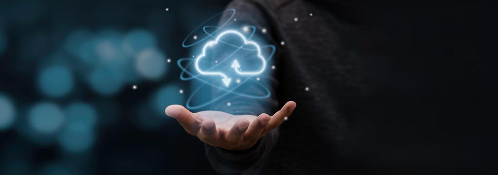 A hand holding a cloud reflecting cloud computing